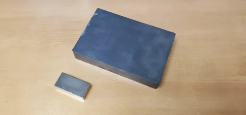 C8 Ceramic and Rare Earth Magnet Blocks Next to Each other