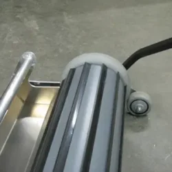 continuous discharge magnet sweeper for picking up shot