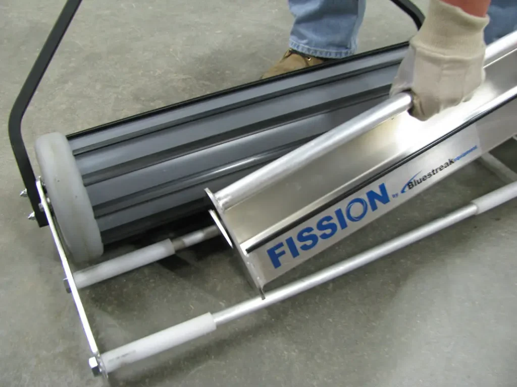 magnetic sweeper for picking up shot fission debris bin