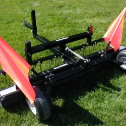 Rhino sweeper shown with optional Debris Digging Rake mounted to front of sweeper