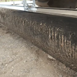 PVC Quick Clean Off Sleeve covered with fine metal debris on Eiger magnetic sweeper