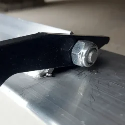 NAOS forklift magnet allows magnet pivot only so far to prevent magnet from sticking to forklift