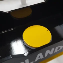 Top view of Upland steel pivot pin with UHMW bushing under it (white)