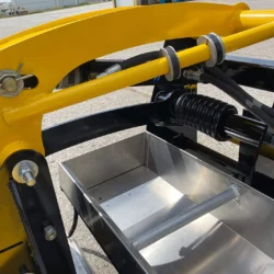 Bac à débris et ressort de torsion