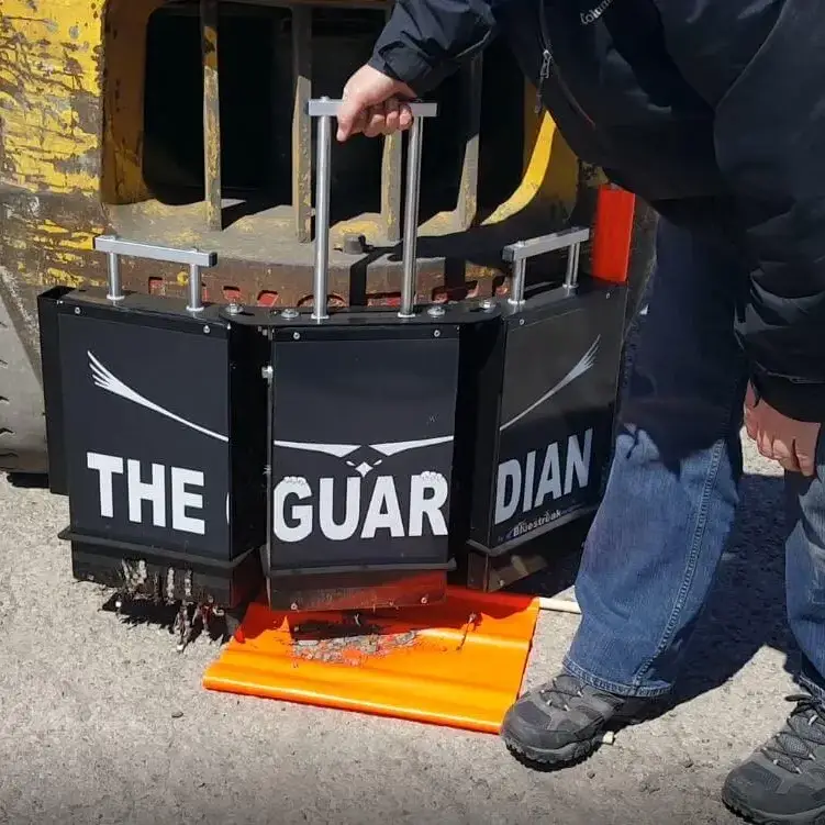 Cleaning off debris from the Guardian Magnet demonstration
