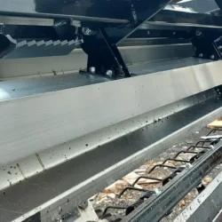 Swing Out Clean Off System for Skidsteer Magnet