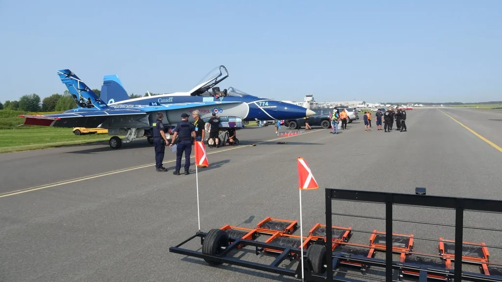 RCAF CF18 on Taxiway with Seeker Airdrag FOD Management Sweeper